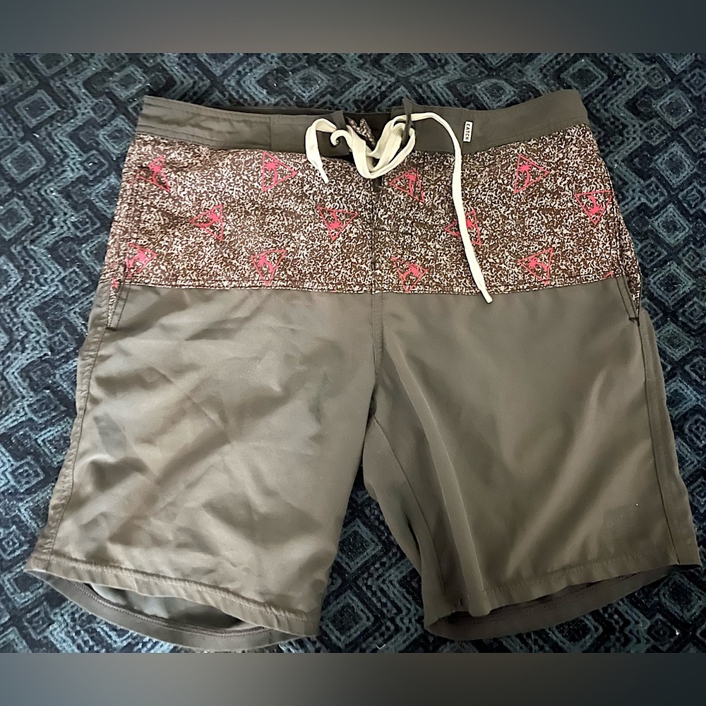 Catch Surf board shorts with pink palm tree accents